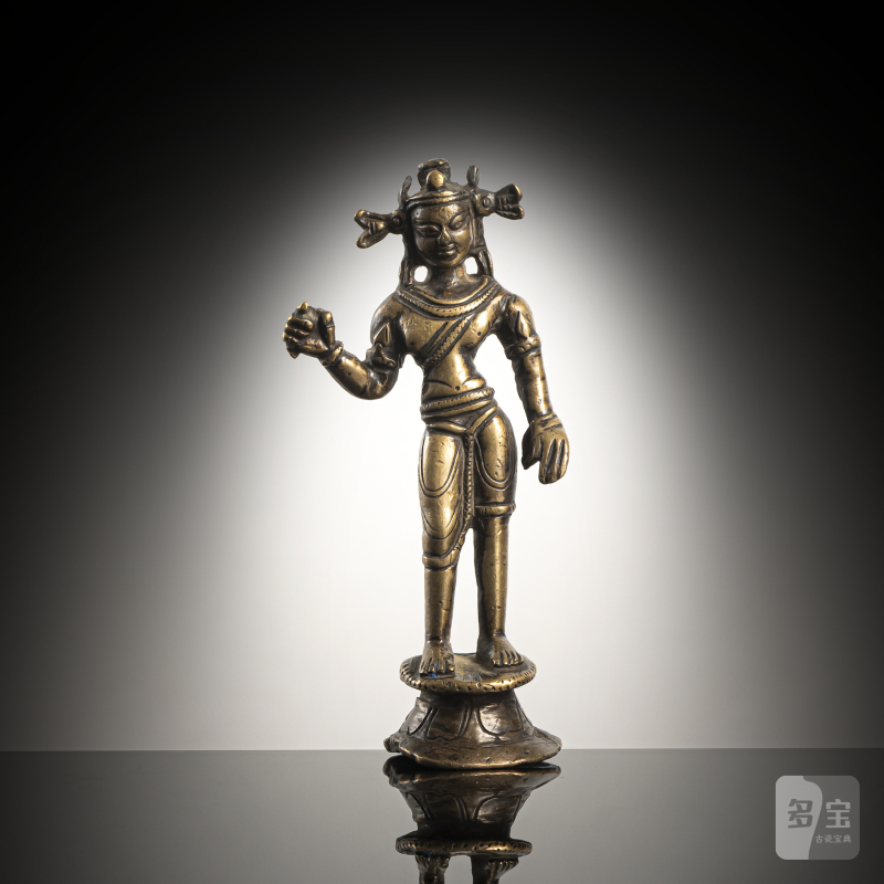A bronze figure of a standing Bodhisattva